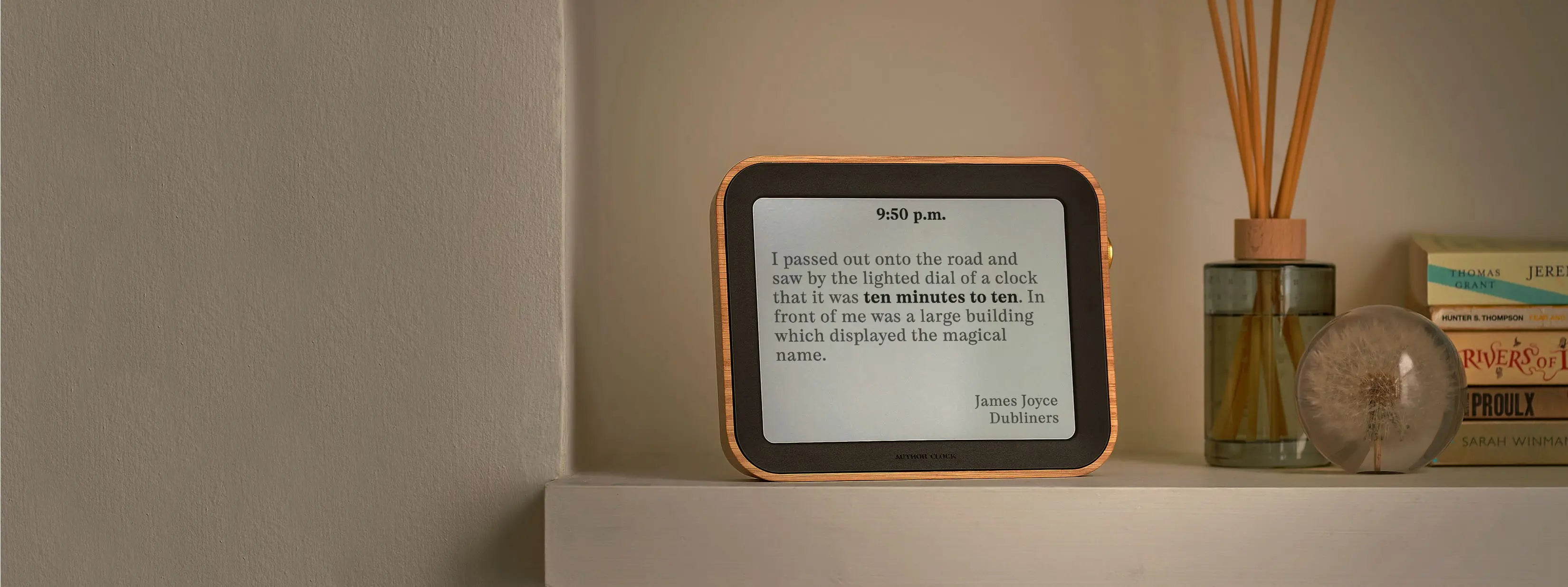 Author Clock Volume 2 on a shelf displaying literary quote by James Joyce