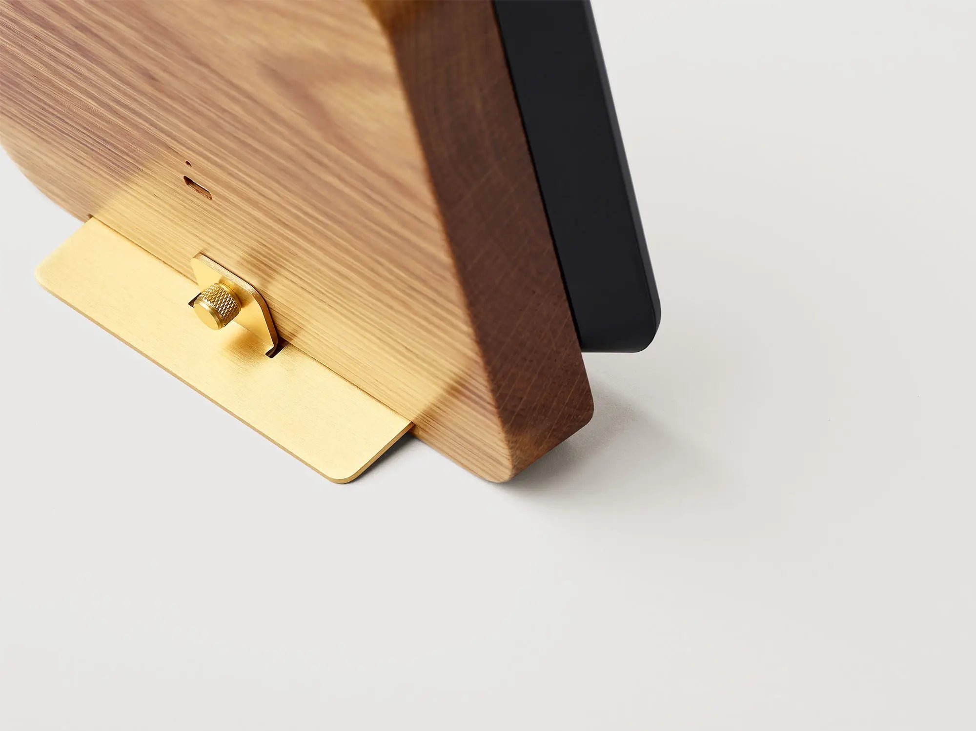 Rear detail view of the Author Forecast showing the brass stand and solid oak body