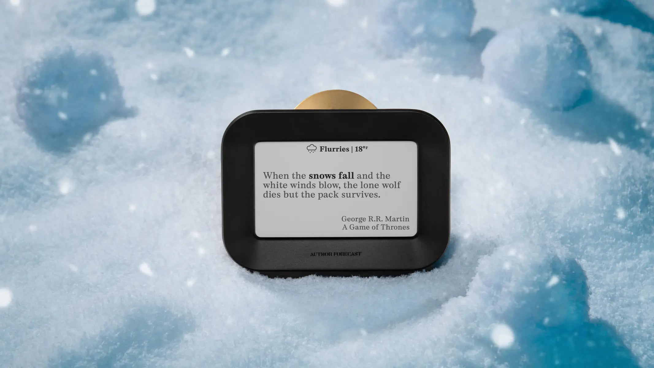 “Author Forecast displaying a snow-themed quote from George R.R. Martin’s A Game of Thrones on its e-paper screen.