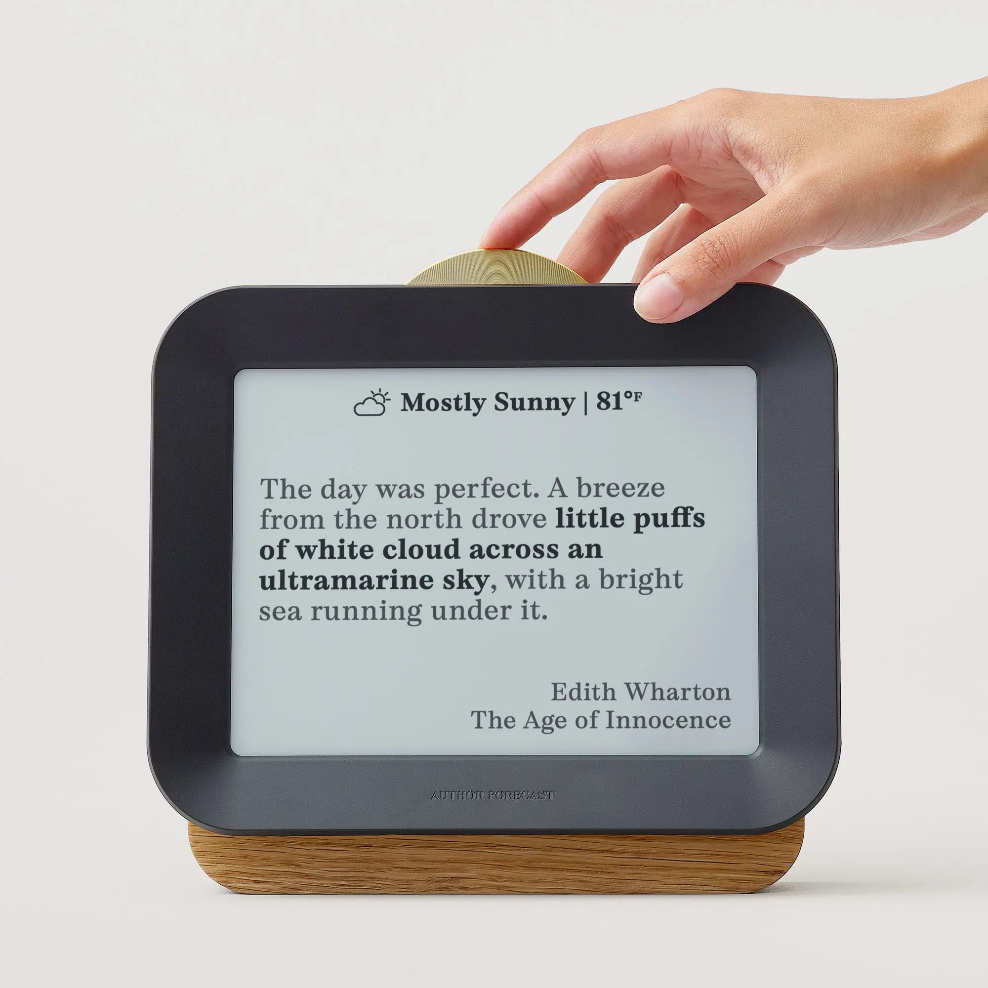 Author Forecast Vol 2 displaying a quote by Edith Wharton from The Age of Innocence about a bright, mostly sunny day, with a hand adjusting the brass sundial dial.